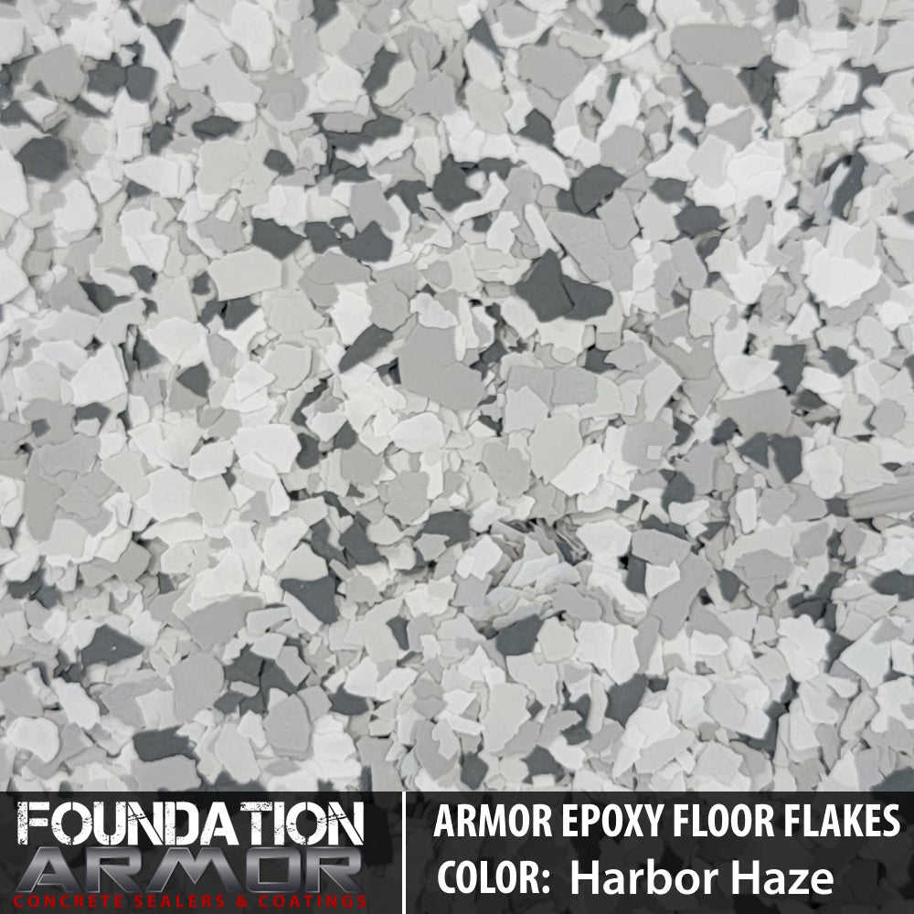 Frosted noir Armor Epoxy Floor Flakes with textured appearance, showing a decorative epoxy floor coating with black and gray flakes.