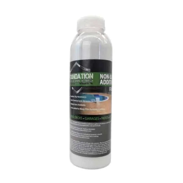 Foundation Armor Ultra-Fine Non-Slip Additive mixed with concrete, showing a close-up of the additive's fine granules for improved traction.